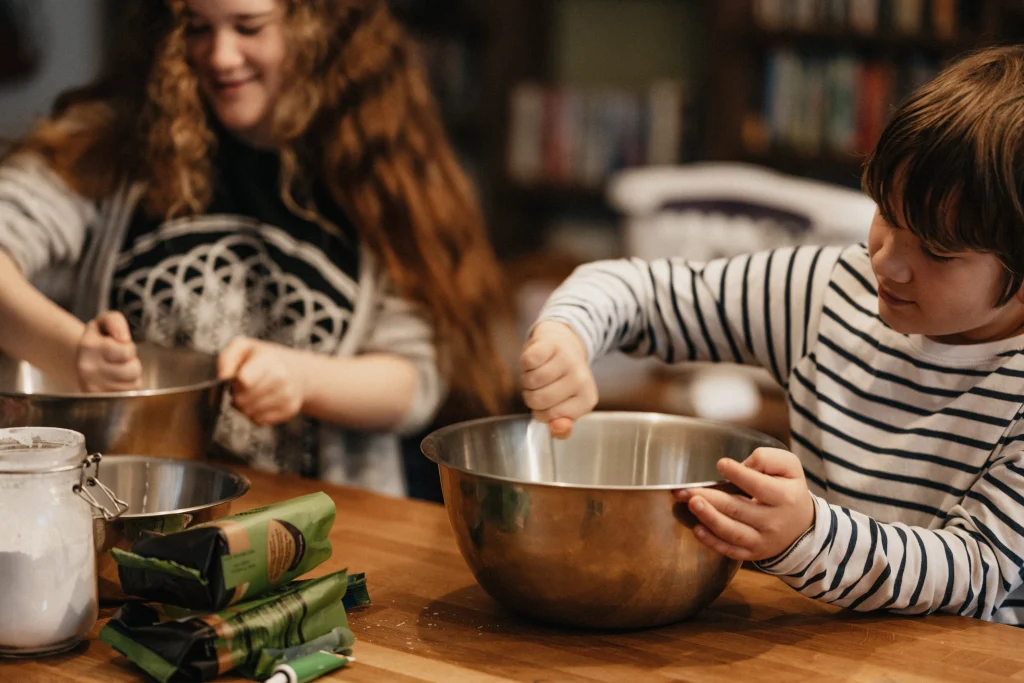 Two children making food