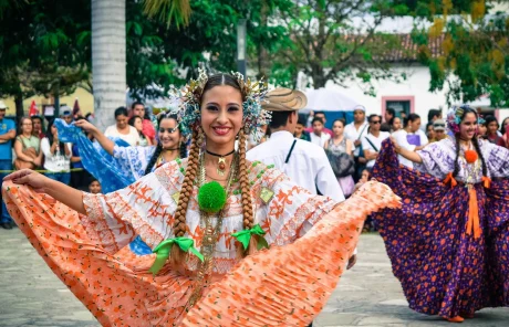 Two women dance in traditional clothing in Costa Rica
